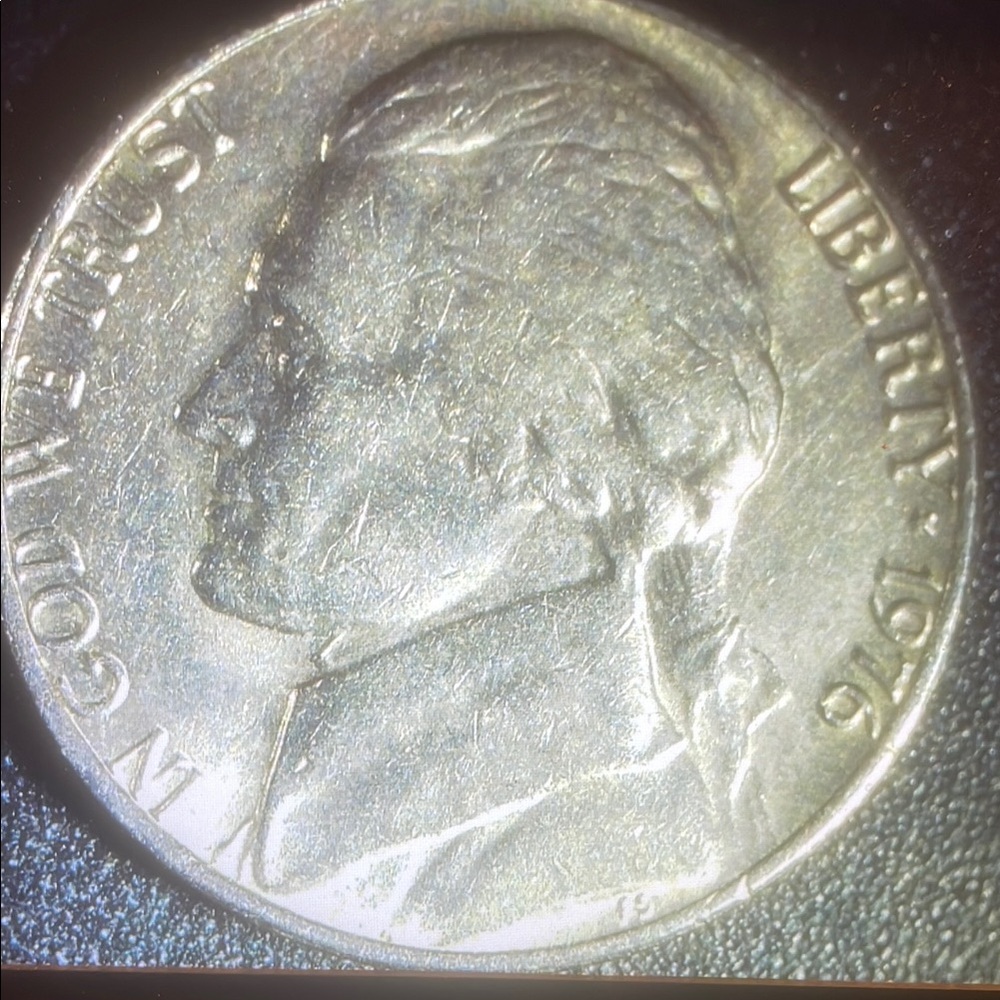Silver Coin with Textured Matte Finish and Detailed Relief